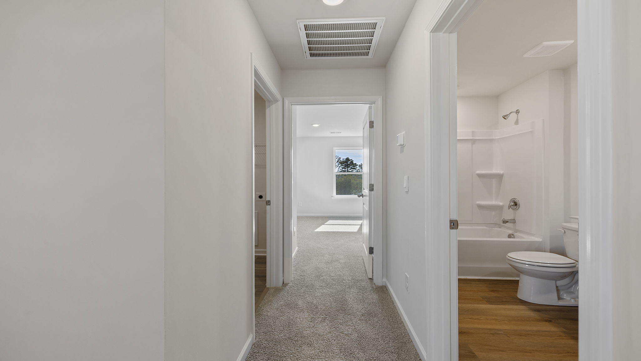 Hallway view of bedrooms and hall bathroom.