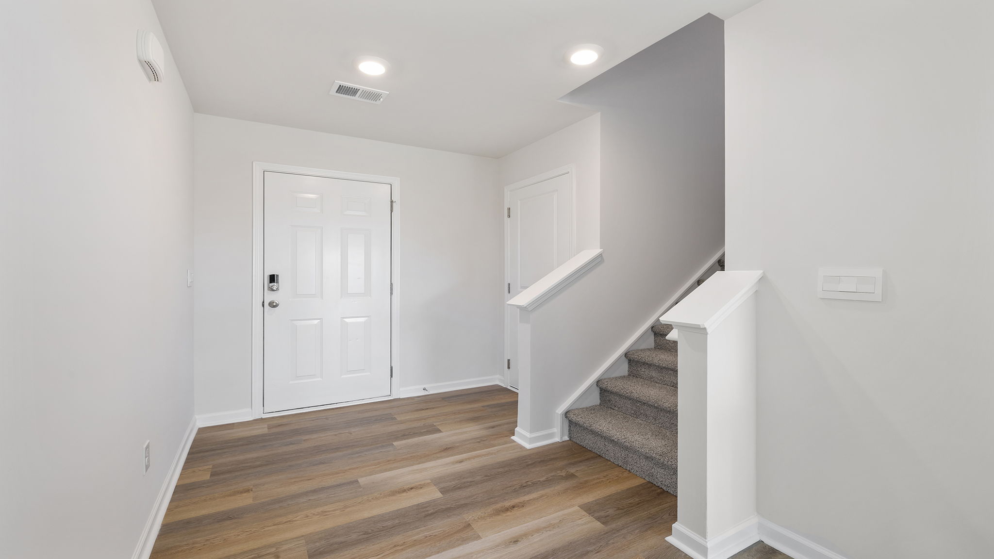 Entrance and stairwell to the upper level.