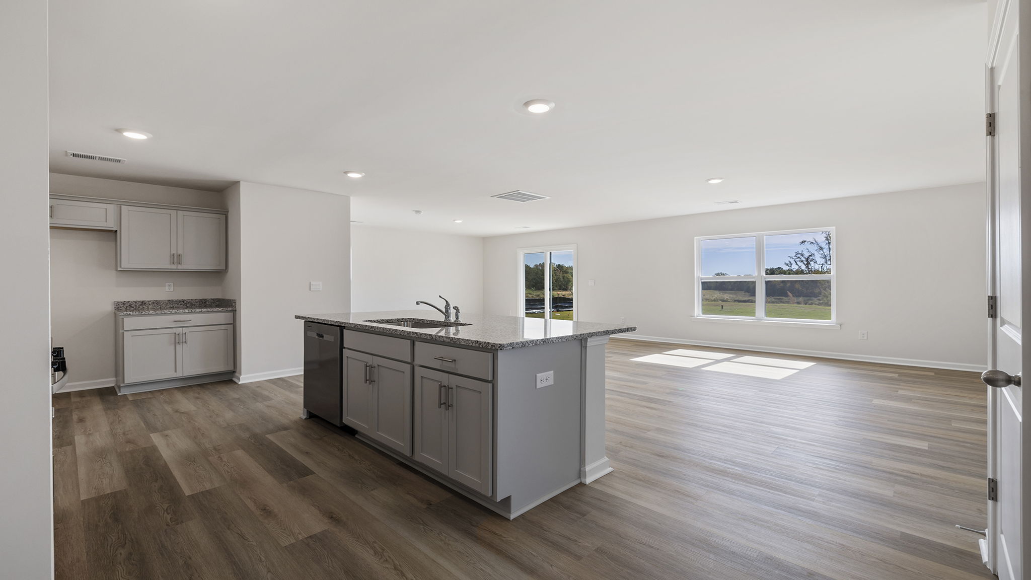View of open floor plan with lots of windows.