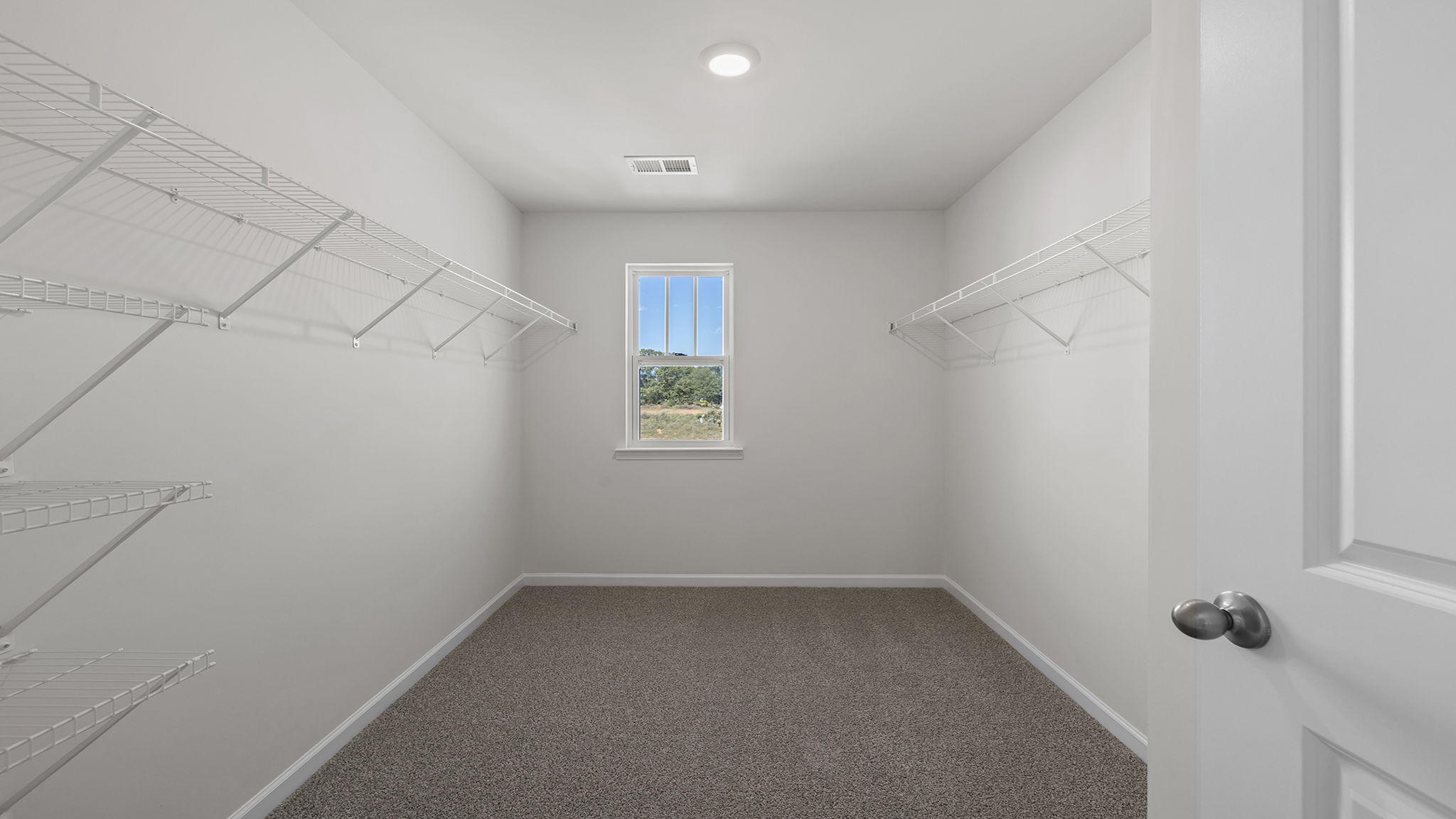 Primary bedroom walk-in closet.