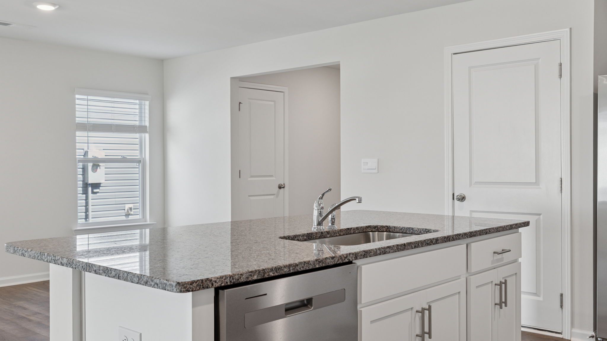 Island hosts sink and dishwasher.