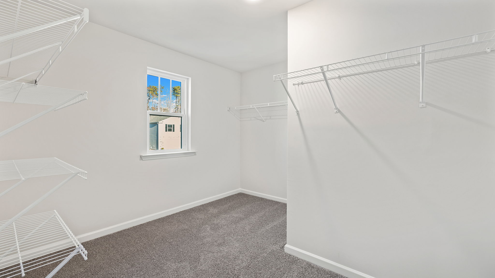 Primary bedroom walk-in closet.