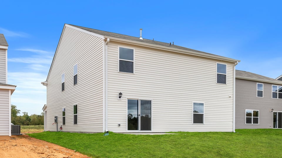 Back exterior with large backyard.