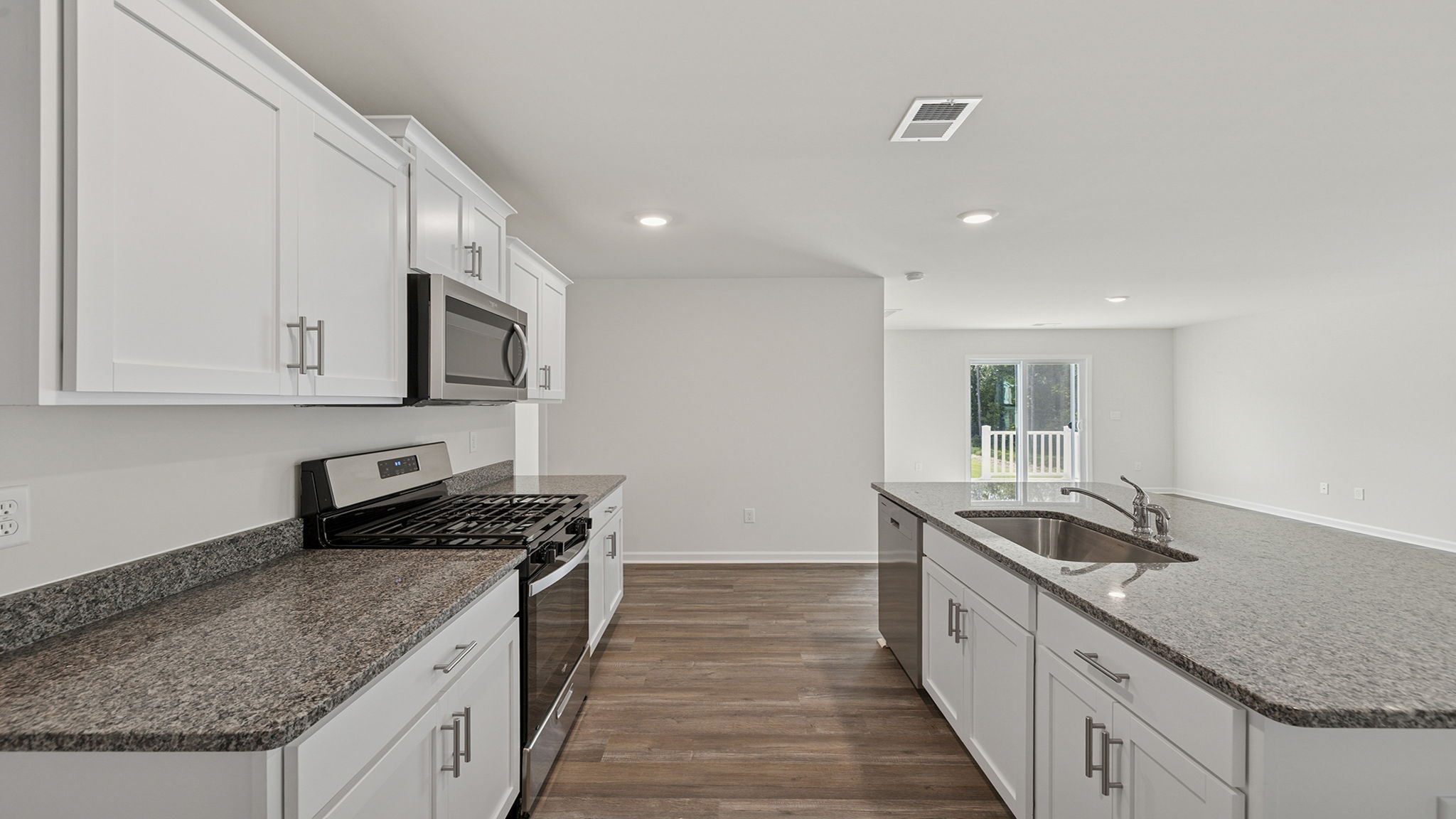 Kitchen and island with quartz counter tops.