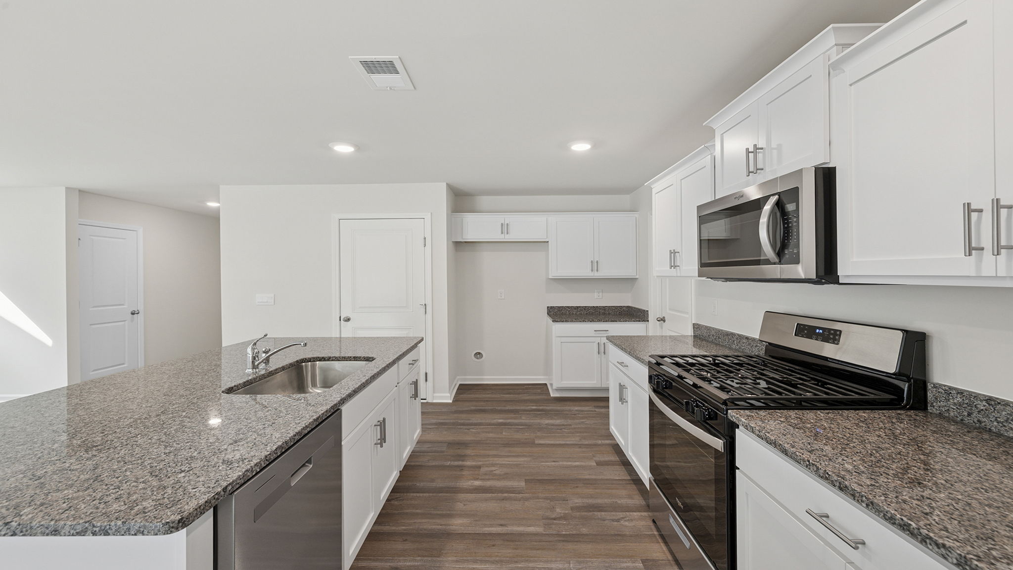 Island hosts sink and dishwasher.