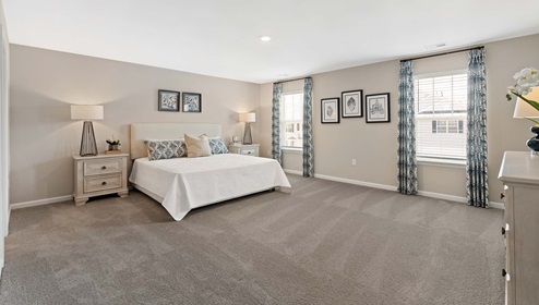 Bedroom with carpet and window.