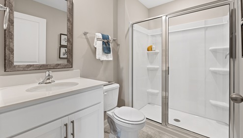 Bathroom with single vanity sink and shower.