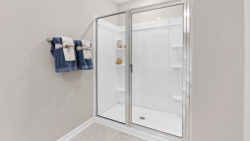 Bathroom with walk in shower.