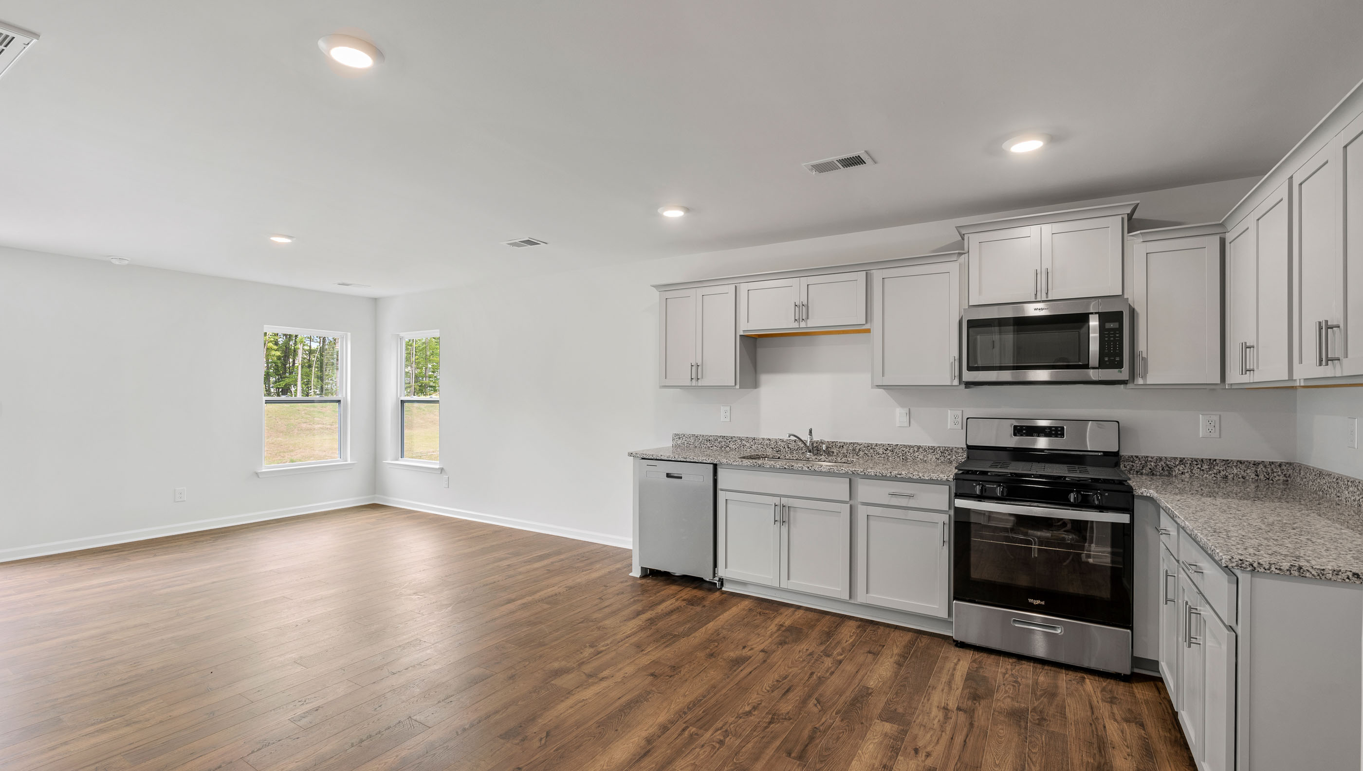Kitchen and island with granite counter tops.