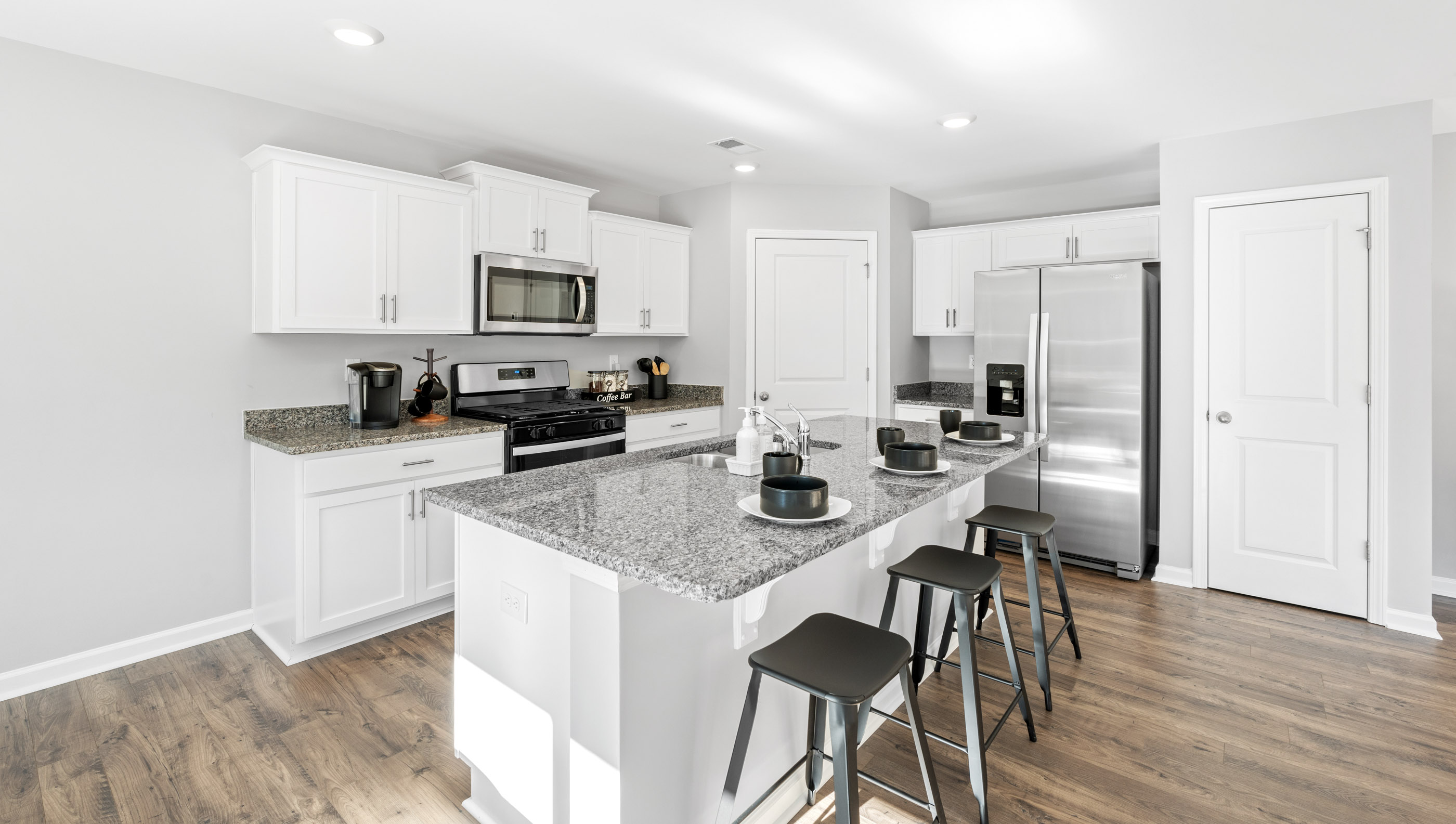 Kitchen with island and cabinets.