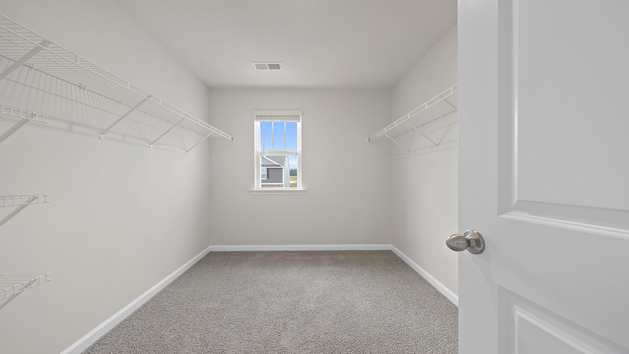 Primary bedroom walk-in closet.