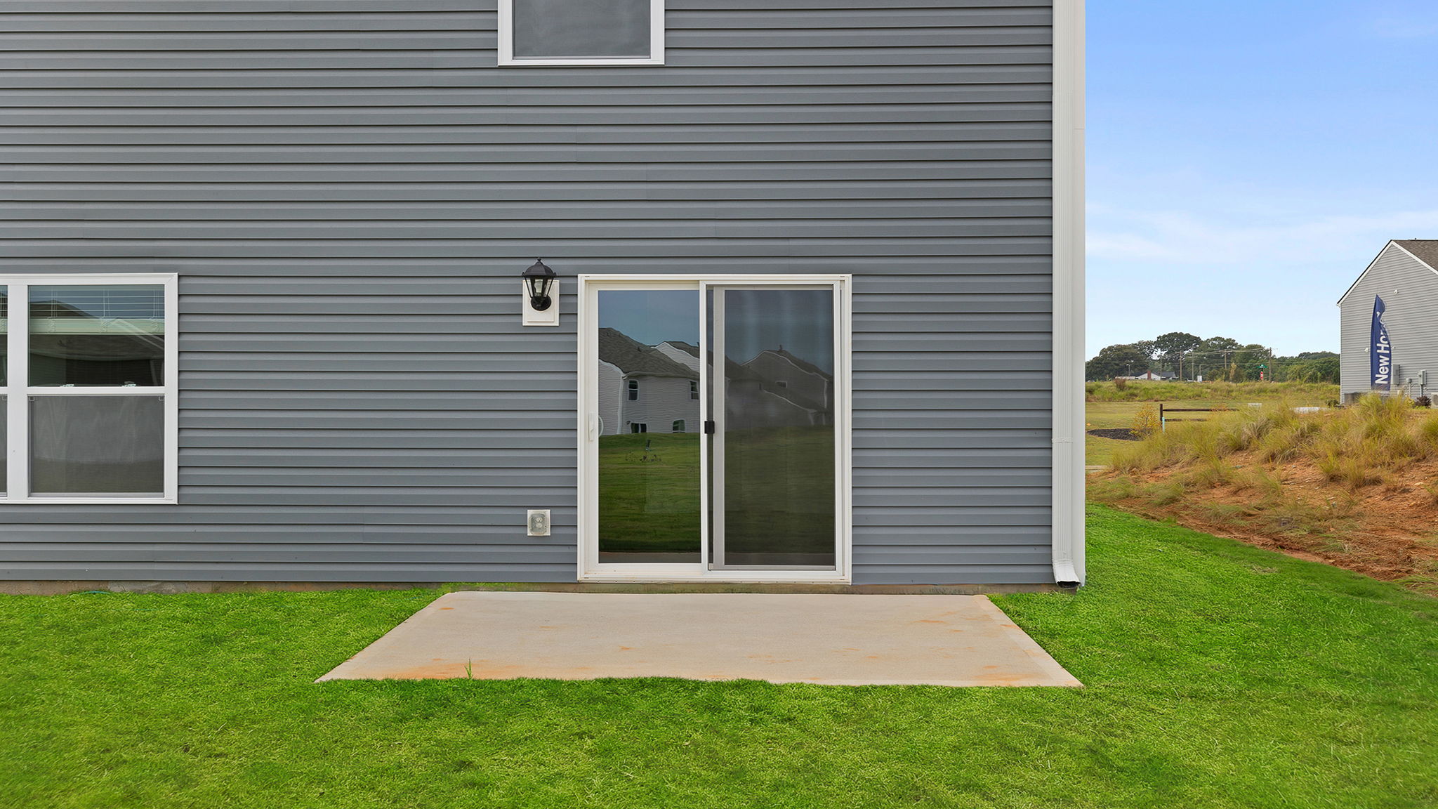 Back exterior view of home and patio.