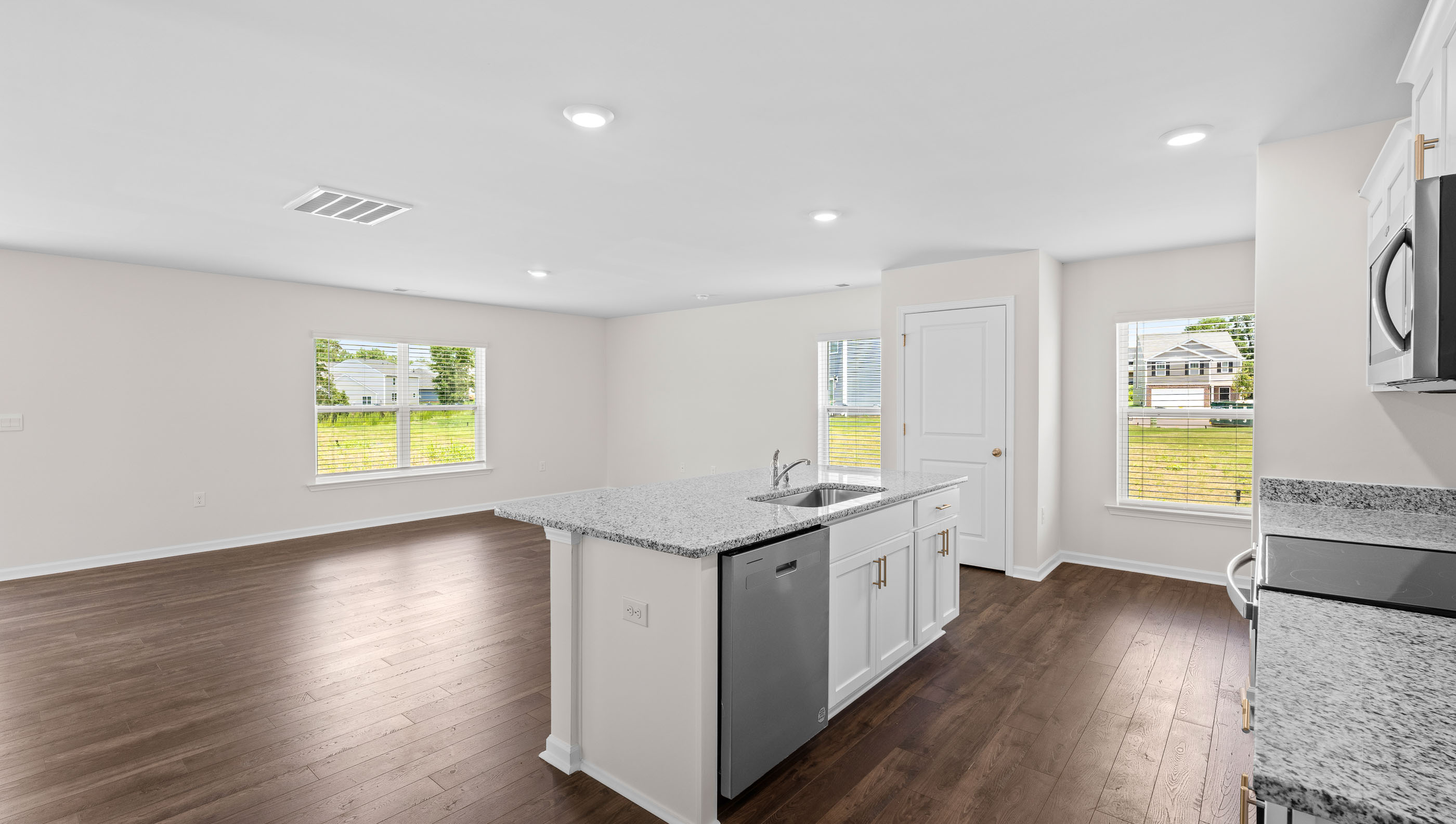 Kitchen with island and cabinets.