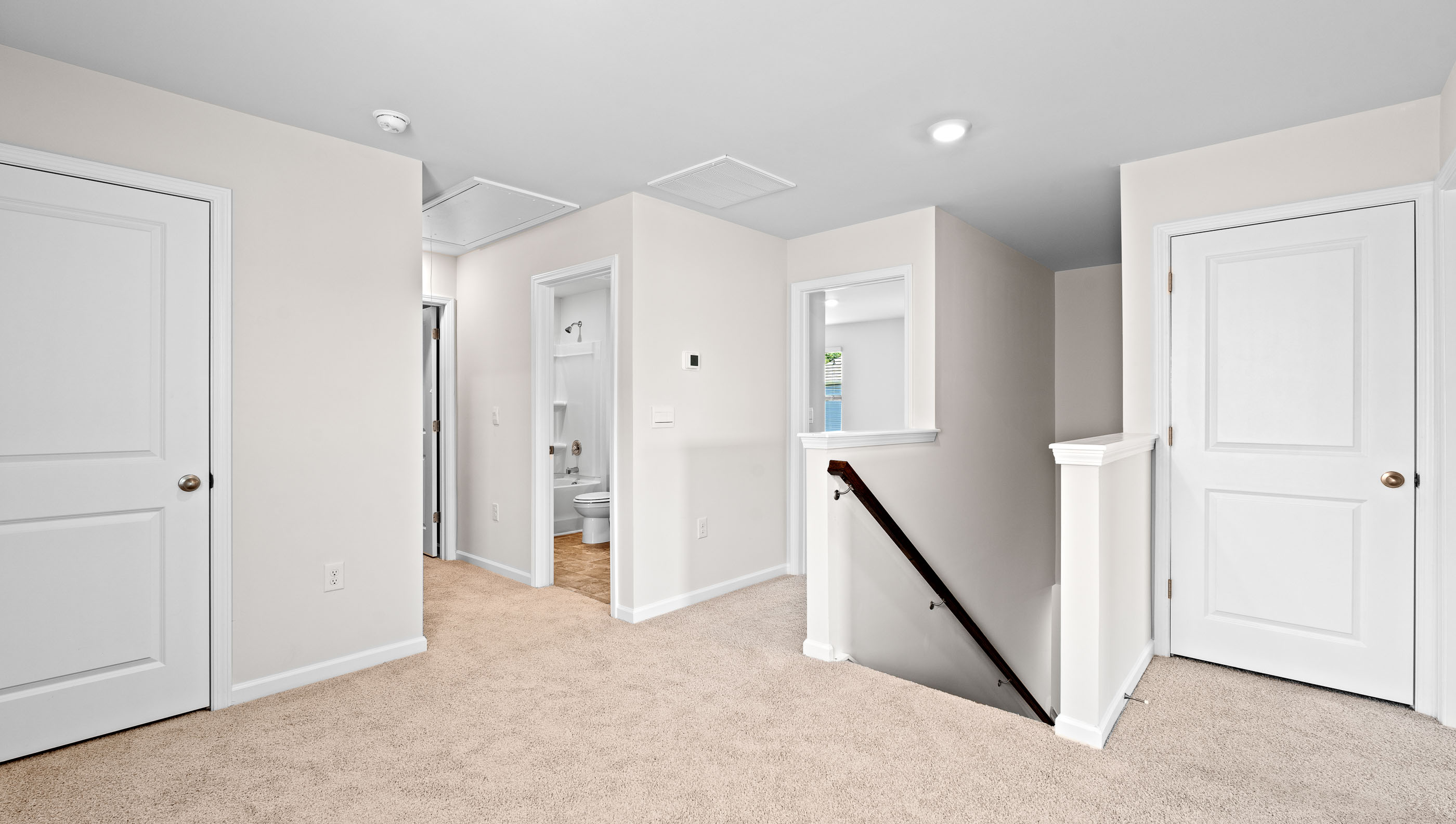 Loft area with carpet.