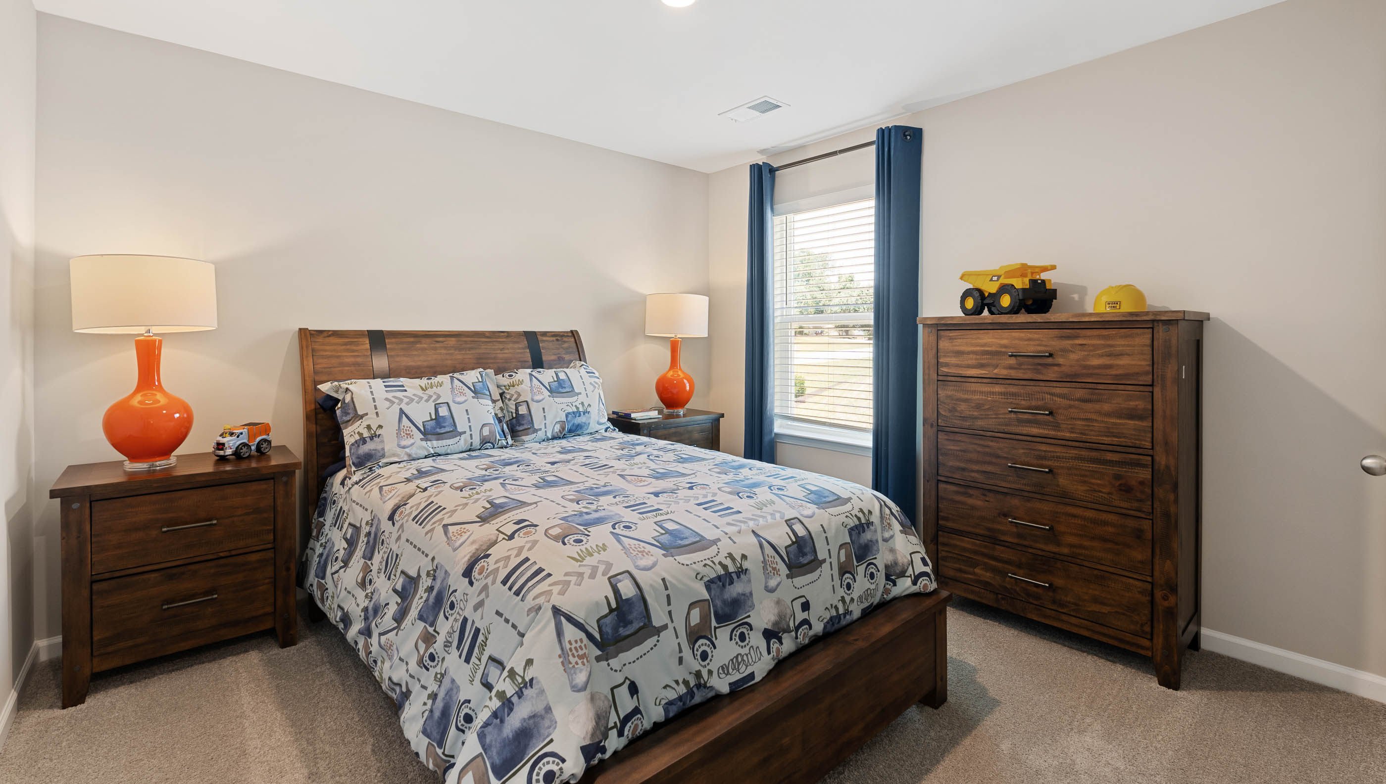 Bedroom with carpet and window.