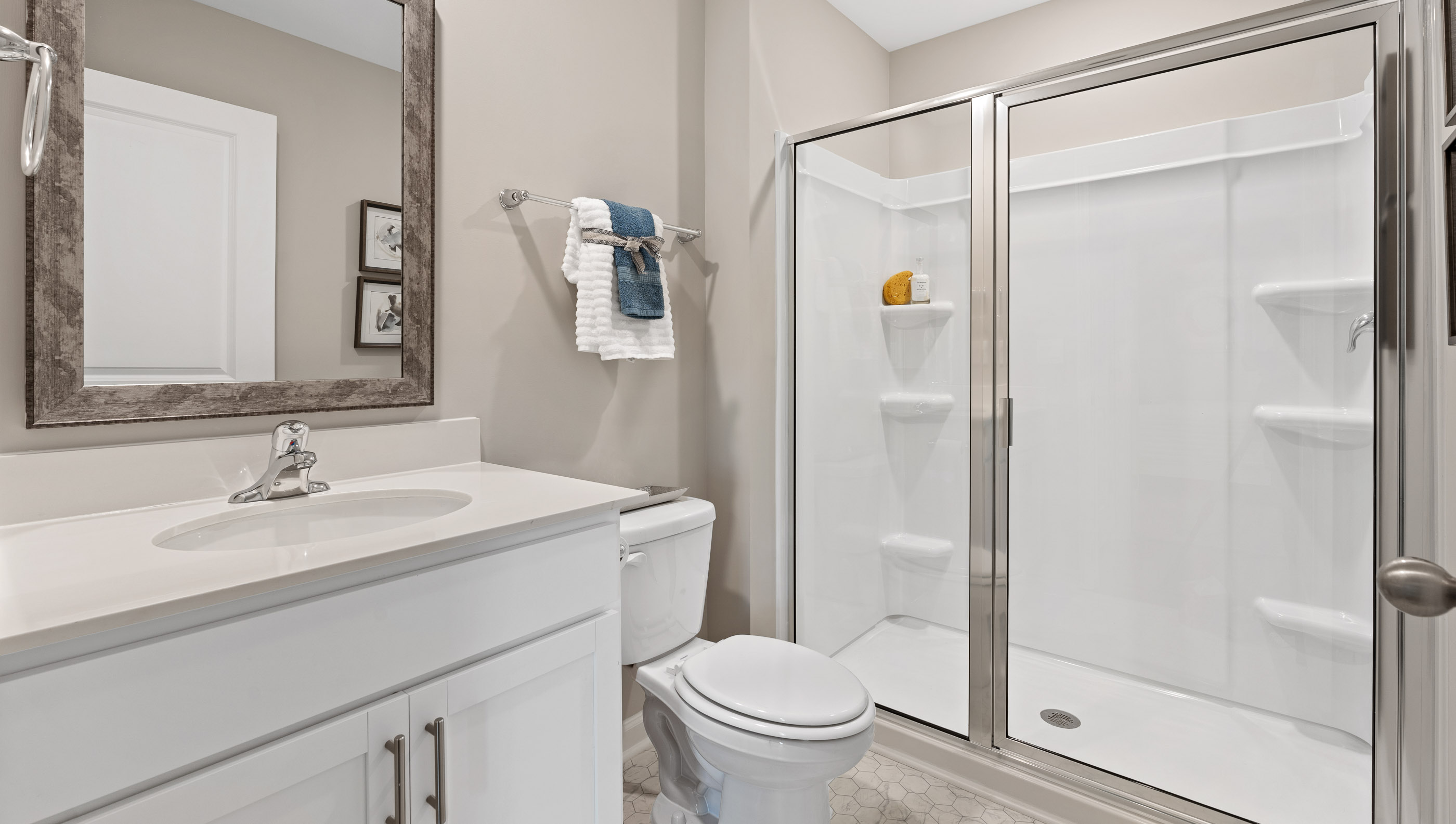 Bathroom with vanity and shower.