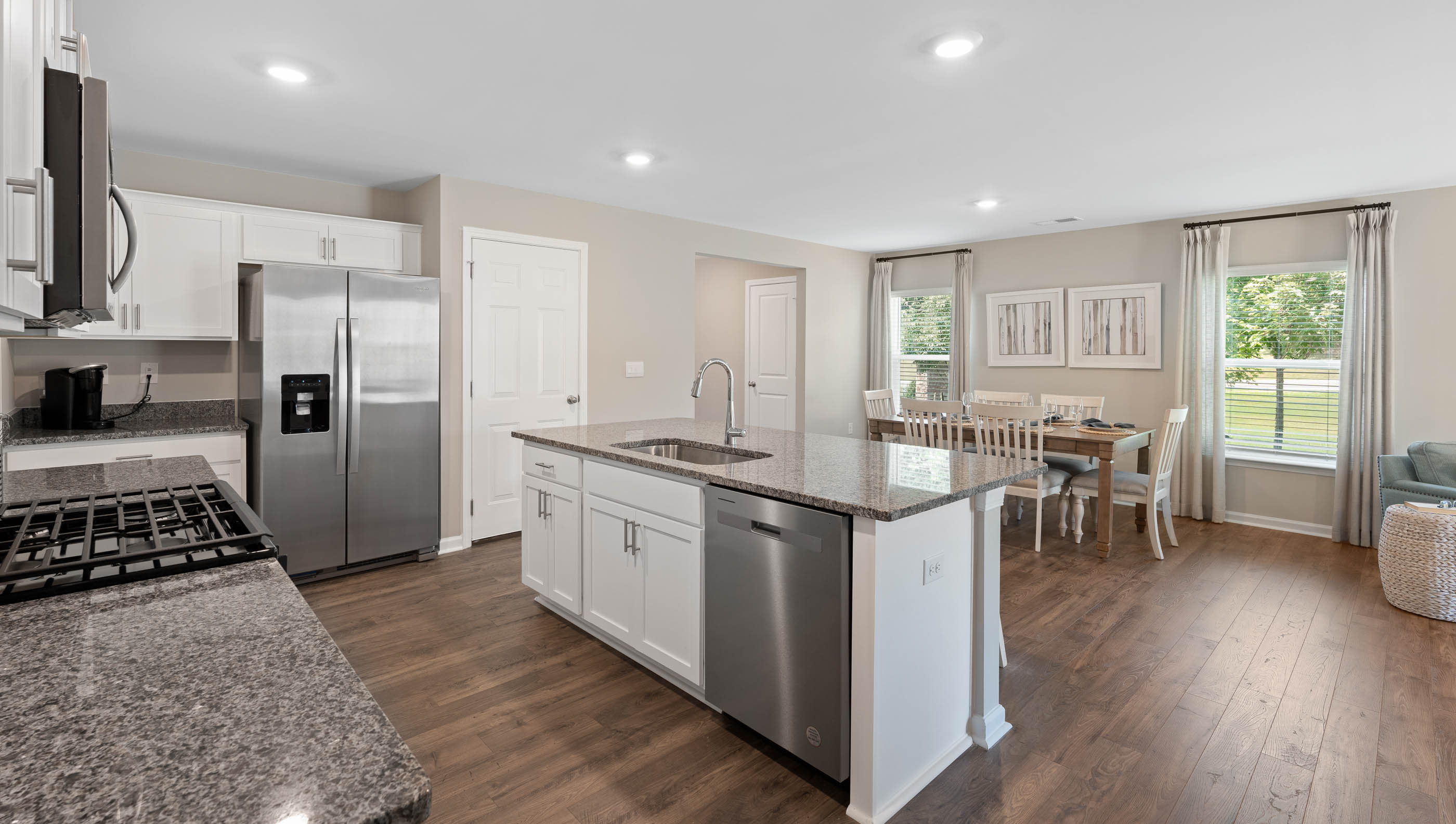Kitchen with island and cabinets.