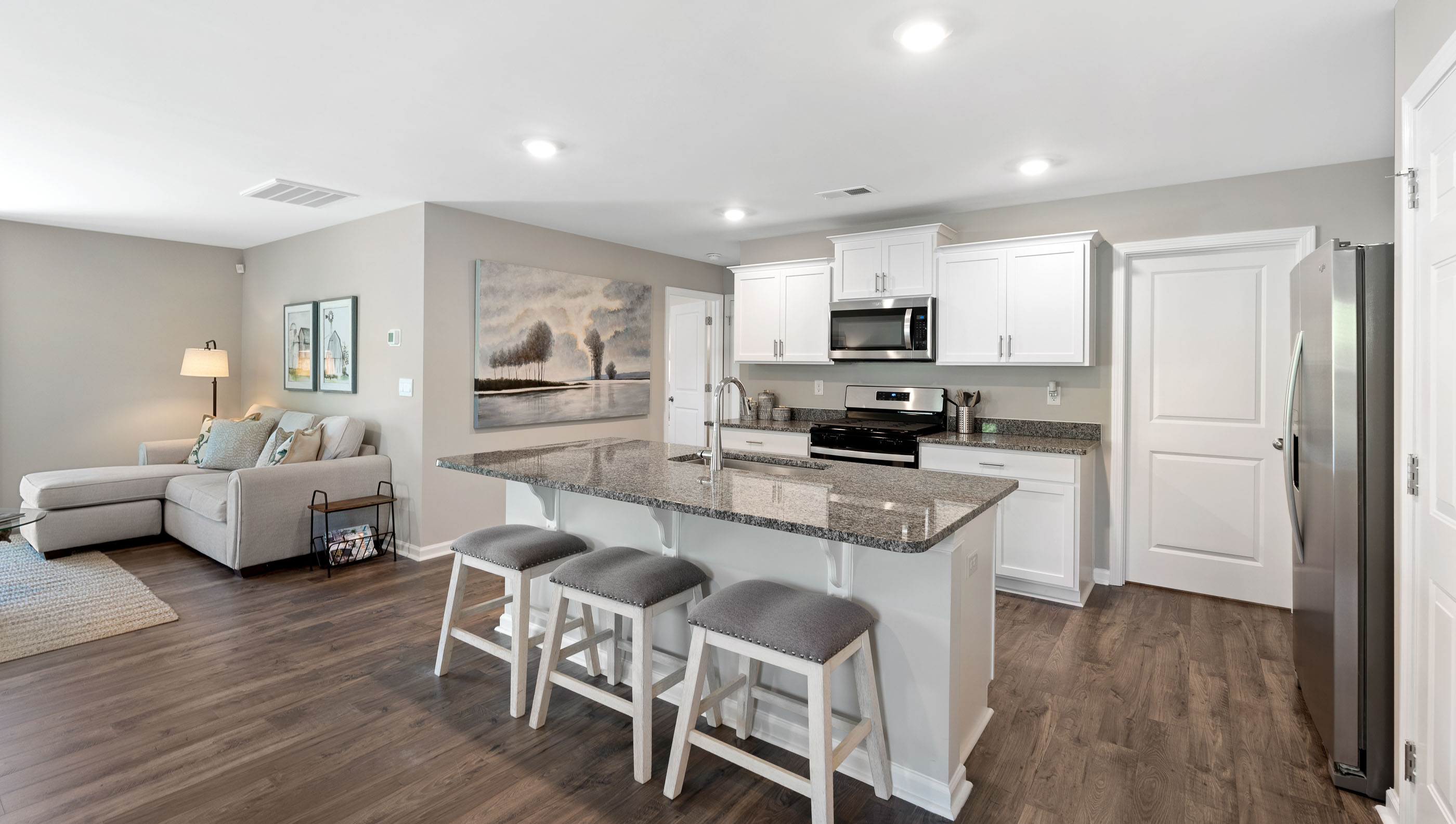 Kitchen with island and cabinets.