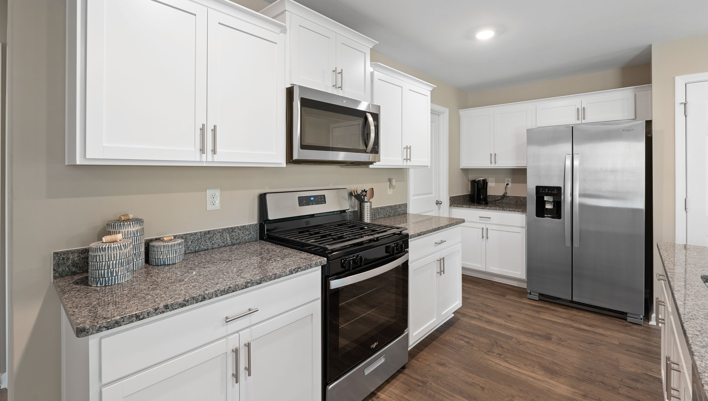 Kitchen with island and cabinets.