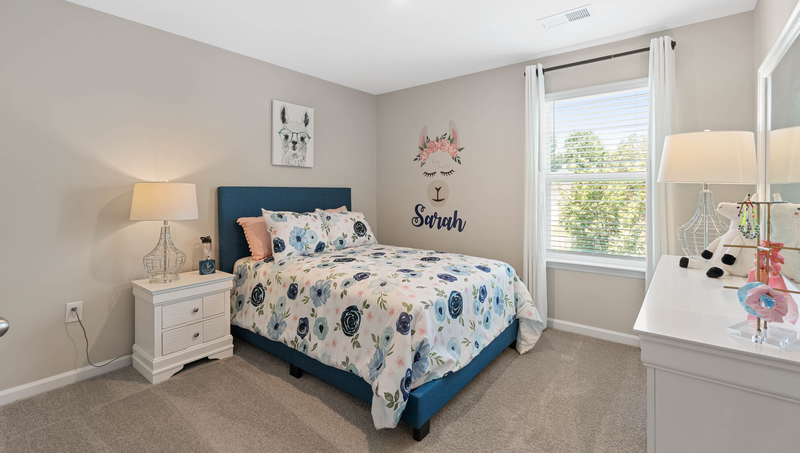 Bedroom with carpet and window.