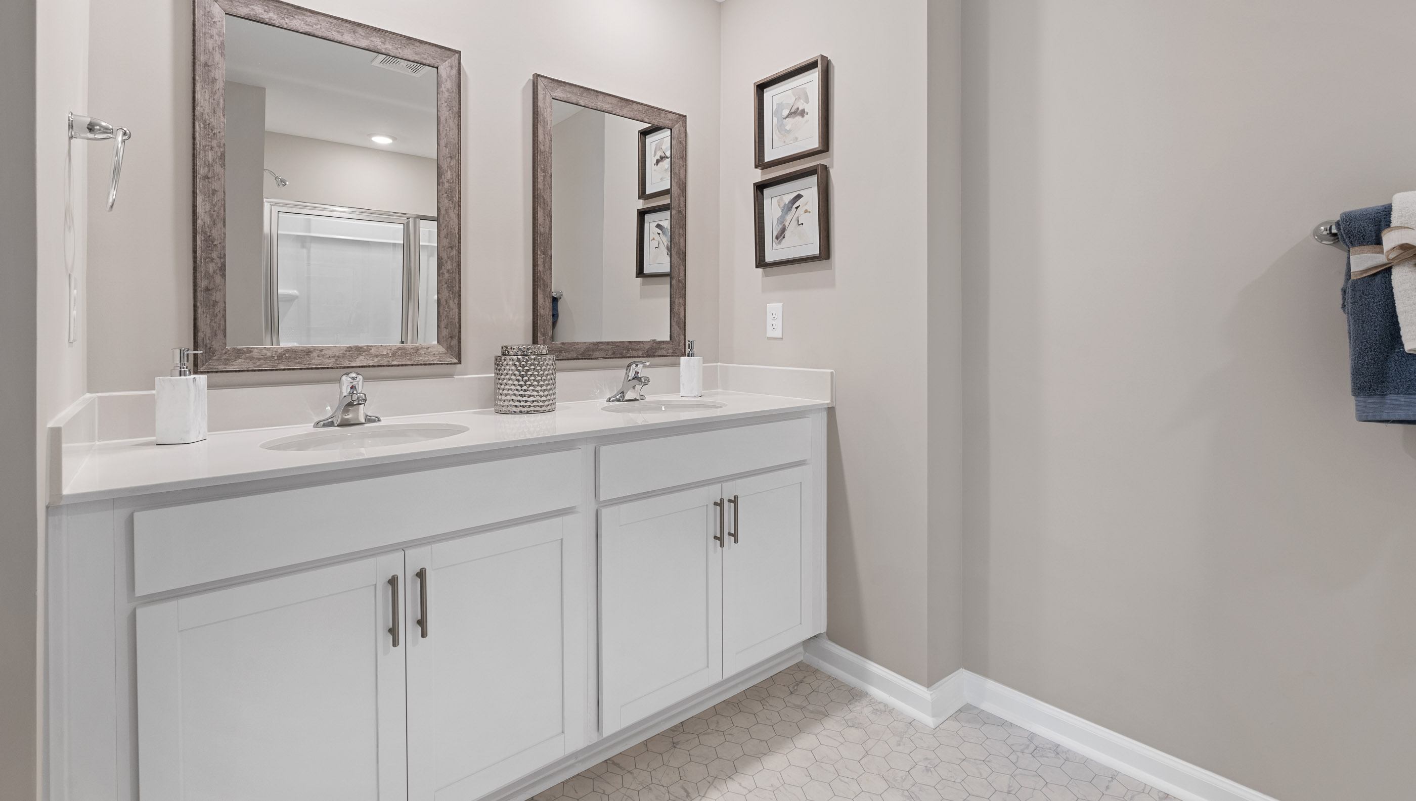Primary bathroom with double vanities.
