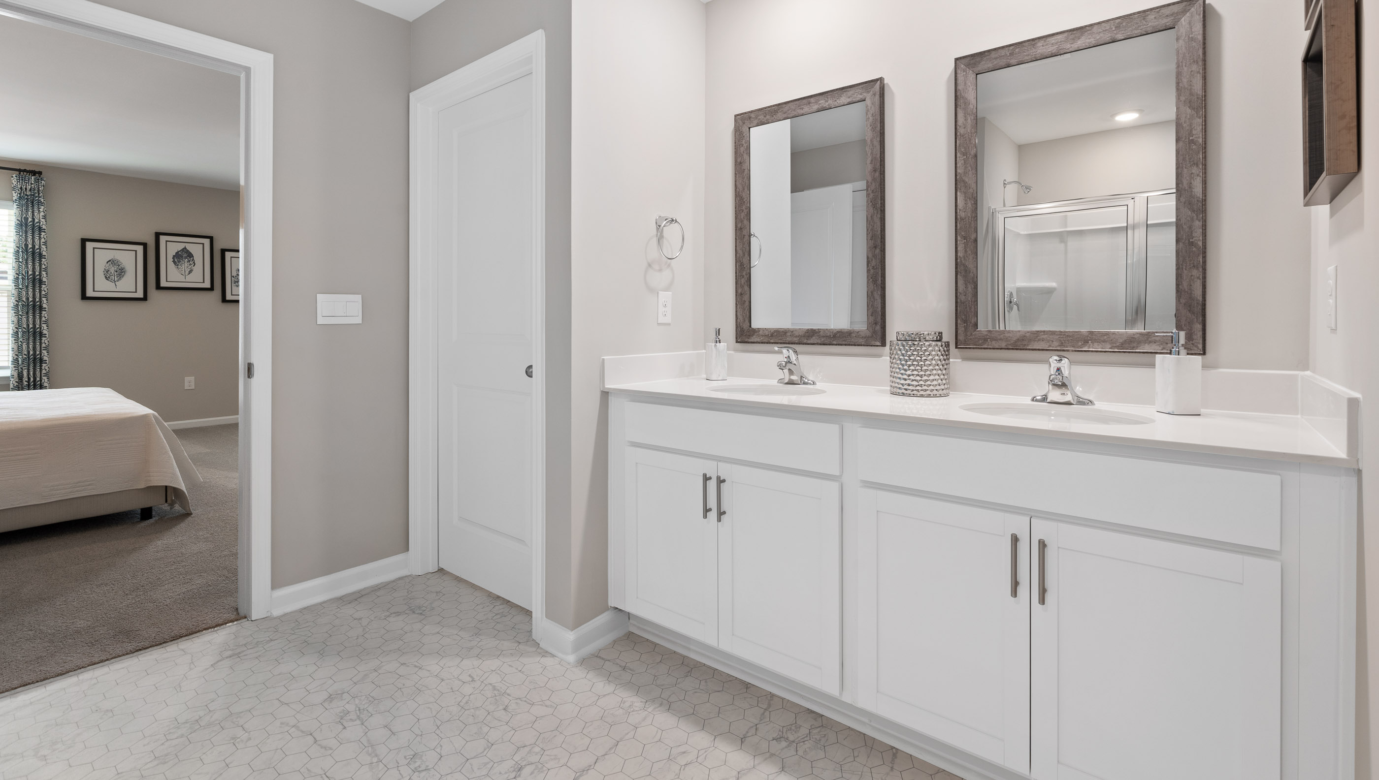 Primary bathroom with double vanities.