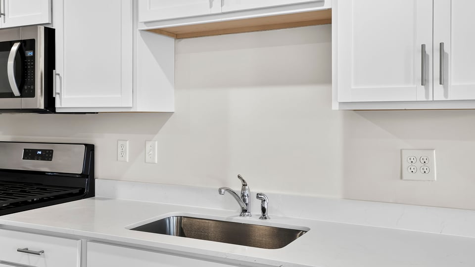 Kitchen with stainless steel appliances.