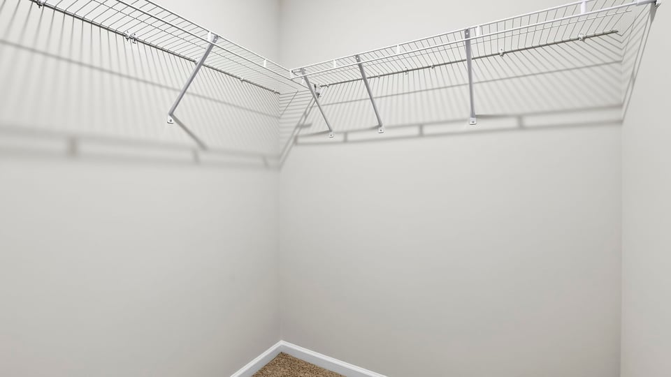 Closet with hanging storage racks.