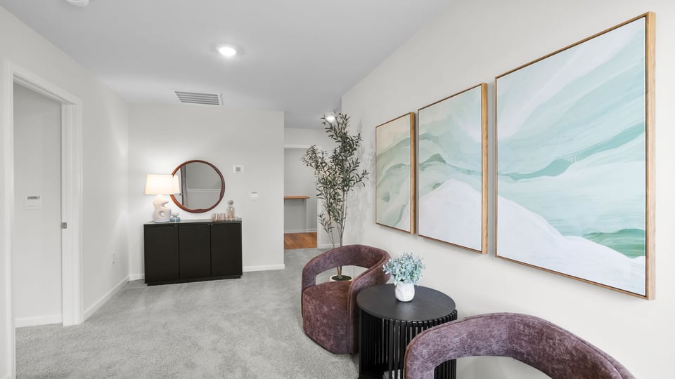 Loft area with carpet and windows.