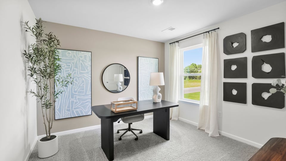 Bedroom with carpet and windows.