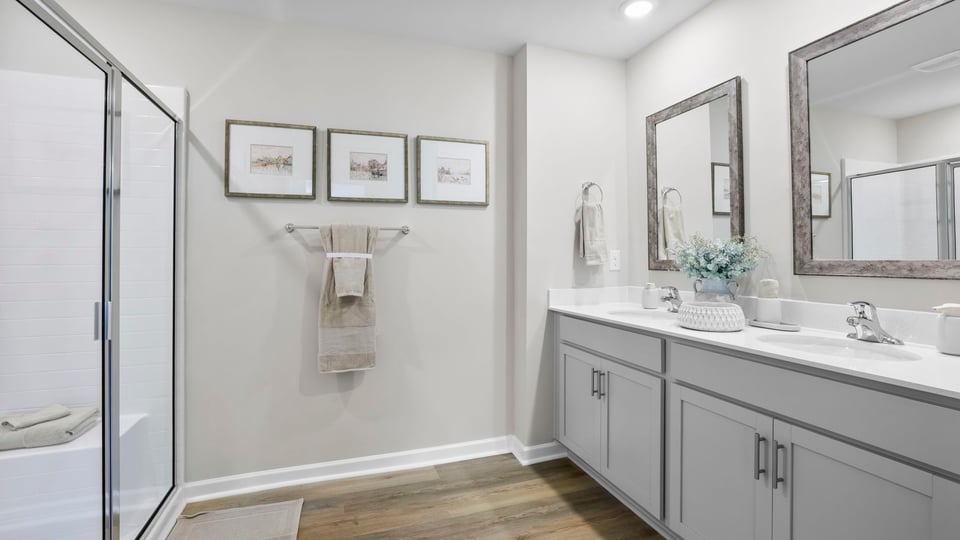 Primary bathroom with double vanity sinks.