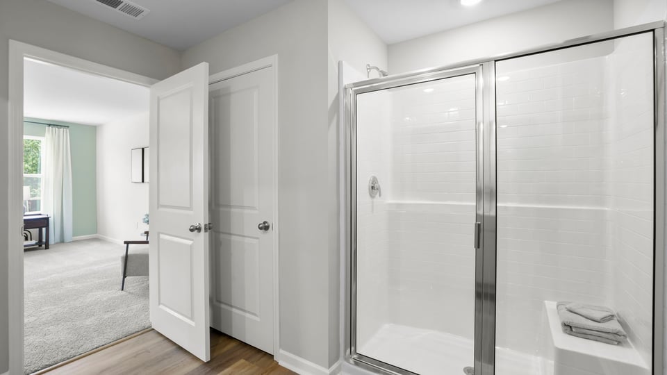 Primary bathroom with double vanity sinks.