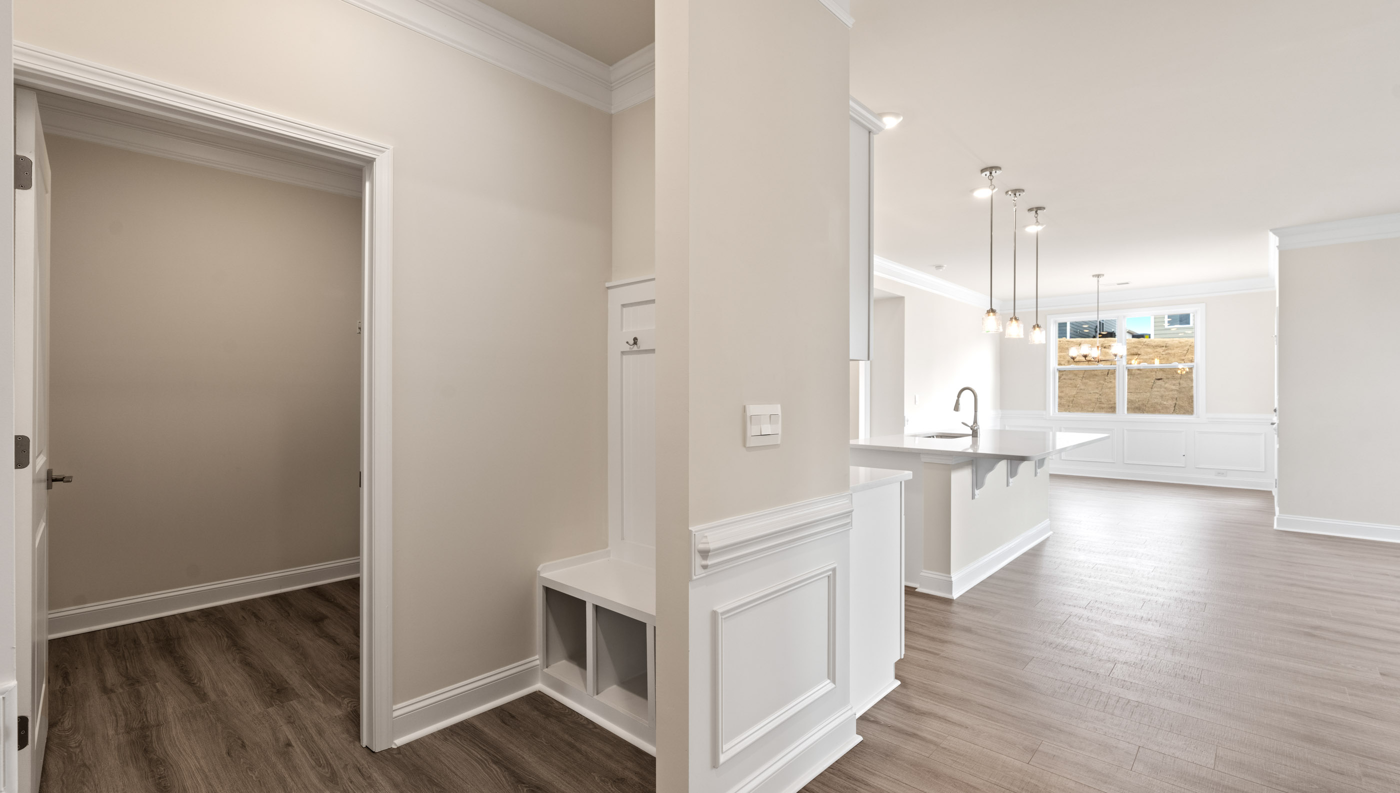 Mud room with hallway to kitchen.