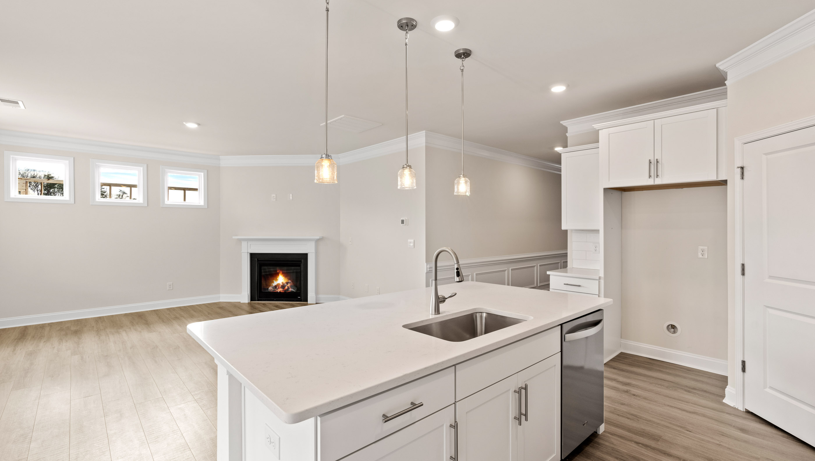 Kitchen with island and quartz countertops.