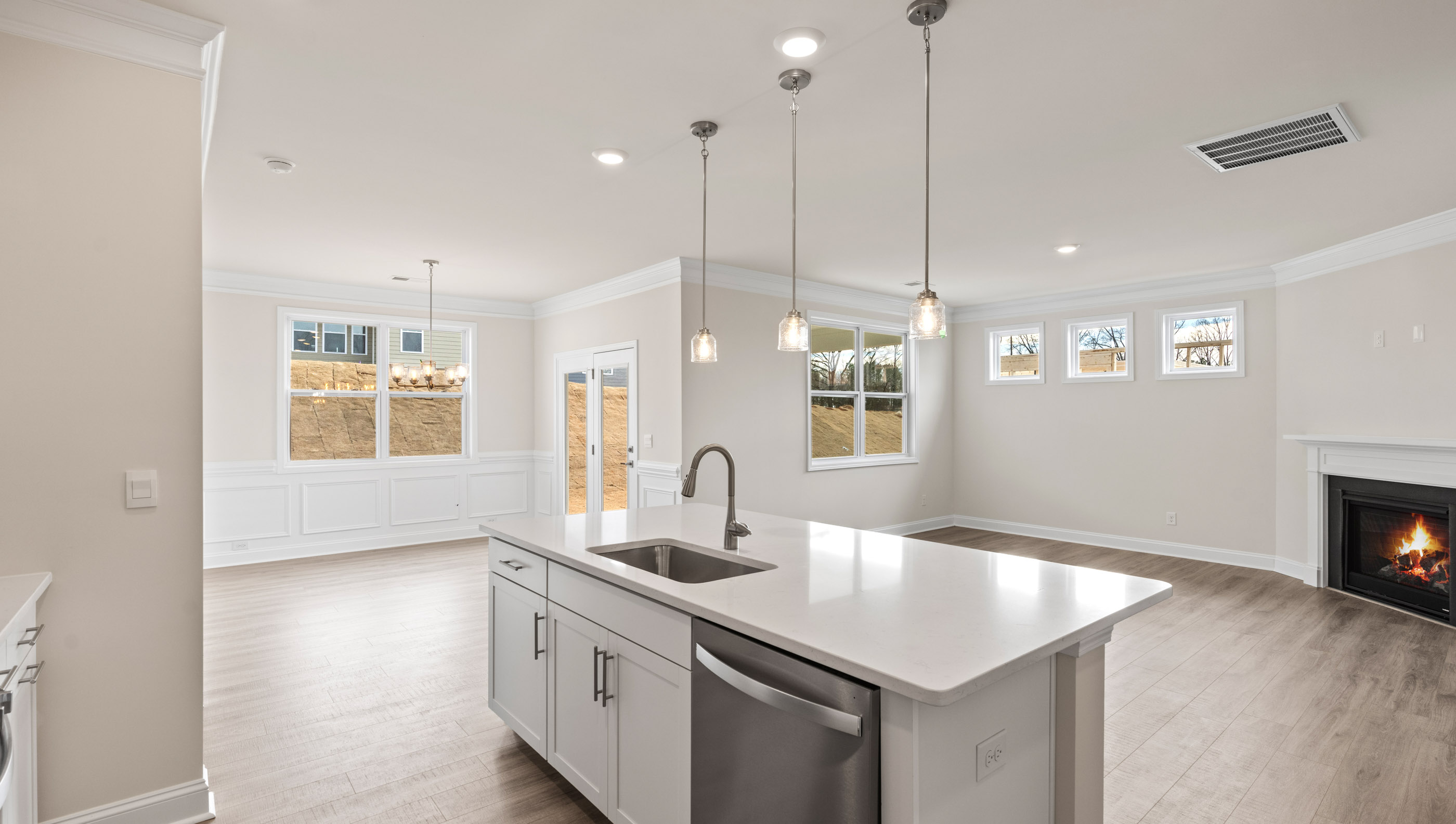 Kitchen with island and quartz countertops.