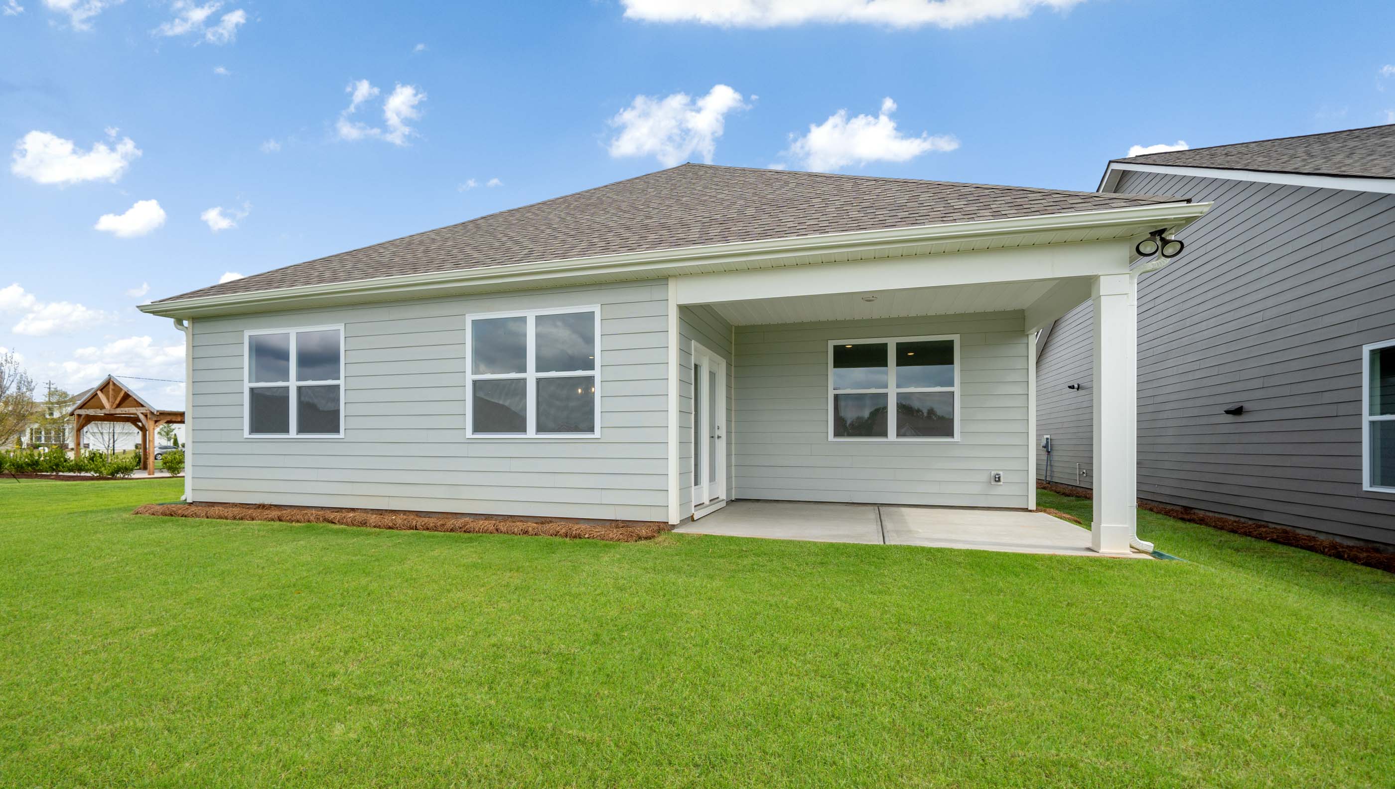 Back exterior view of the Bristol with covered porch.