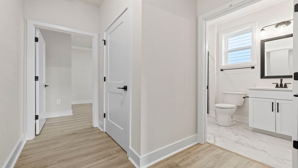 View of hallway and hall bathroom.