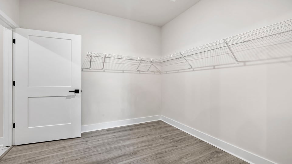 Primary bedroom walk-in closet.