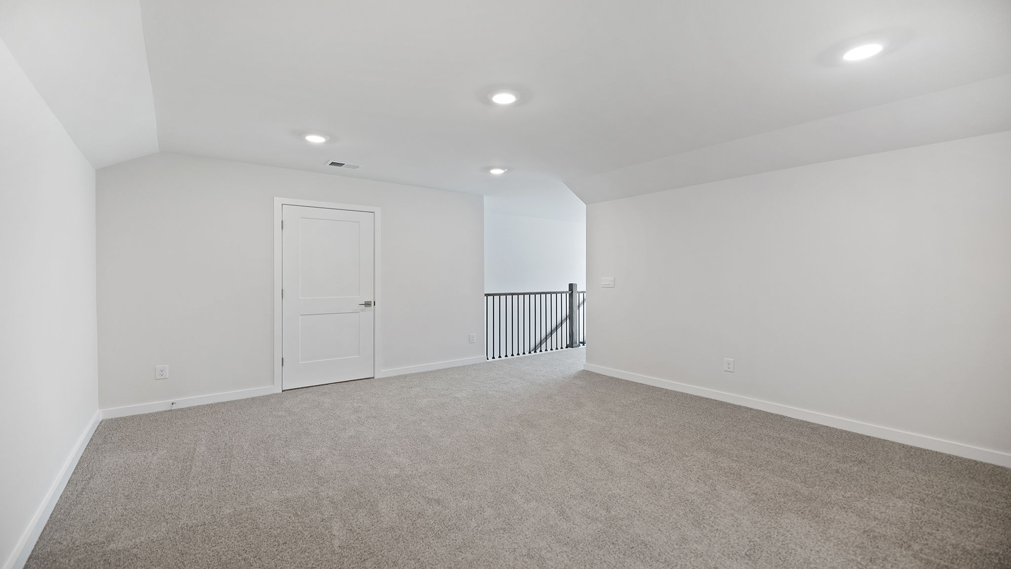 Bonus room with carpet and window.