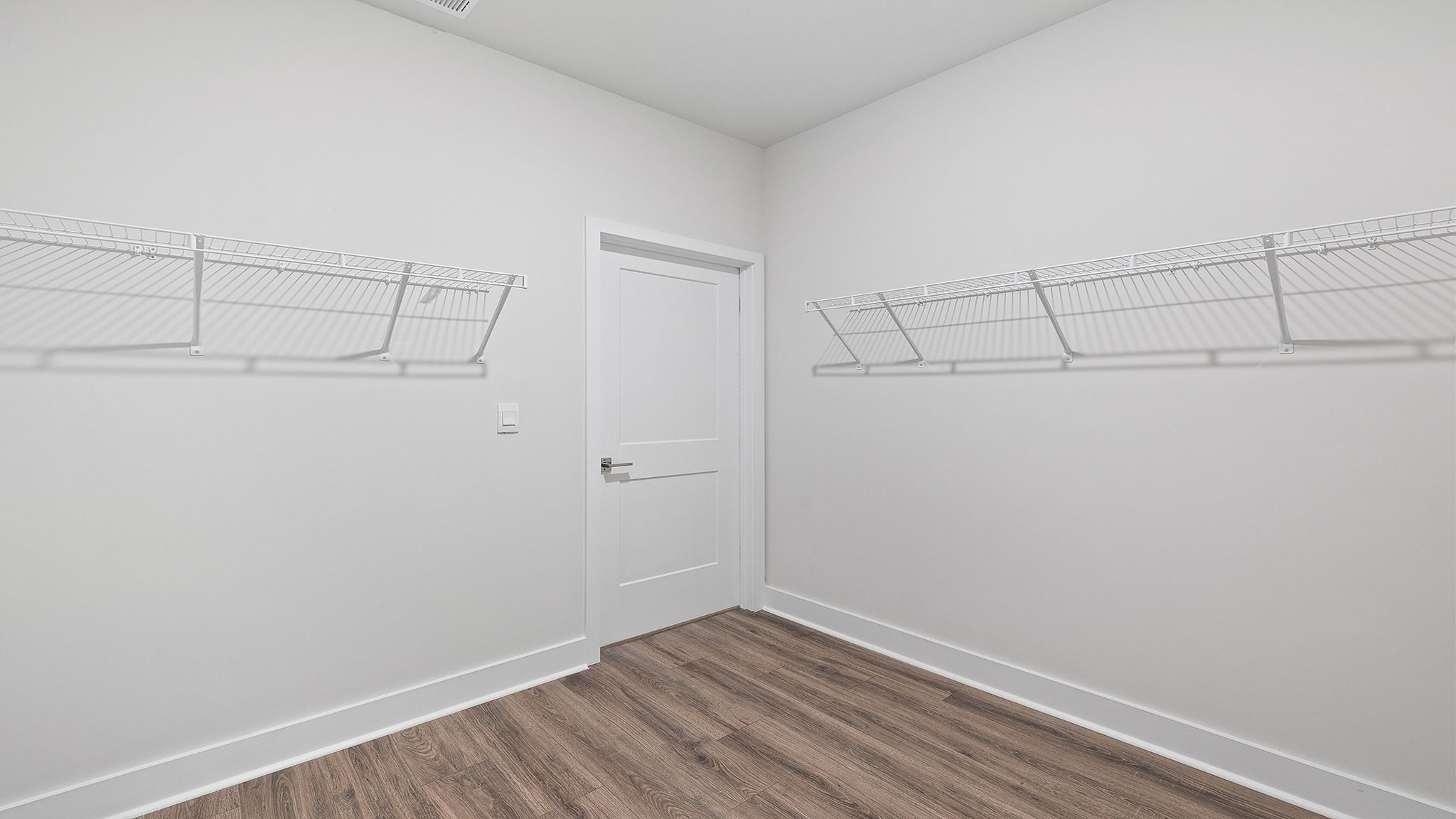 Primary closet with shelf.