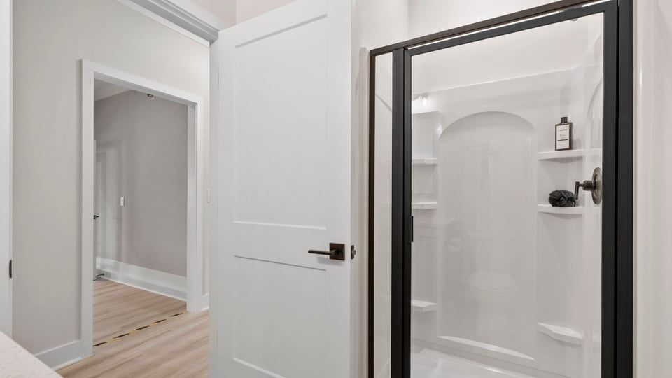 Bathroom with vanity sink and shower.