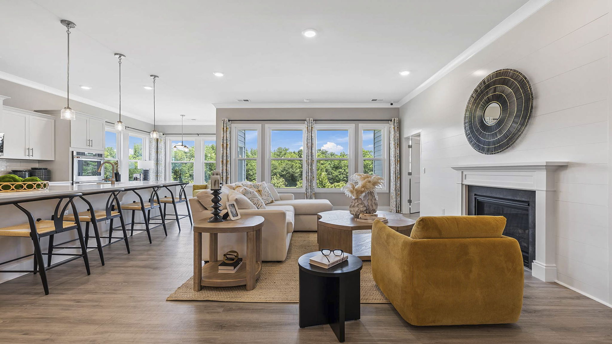 Living area with fireplace and windows.