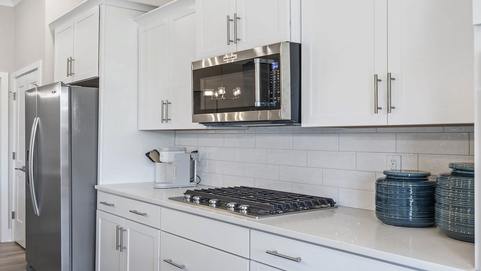 Kitchen with island and cabinets.