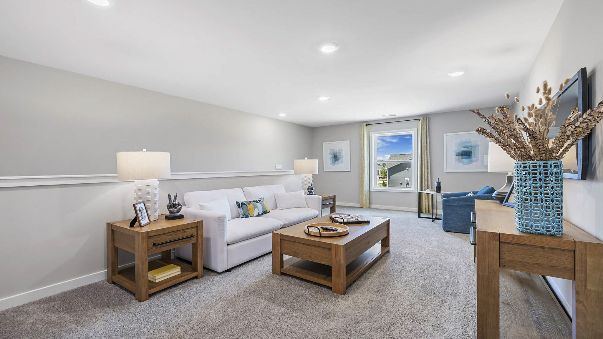 Loft area with carpet and windows.