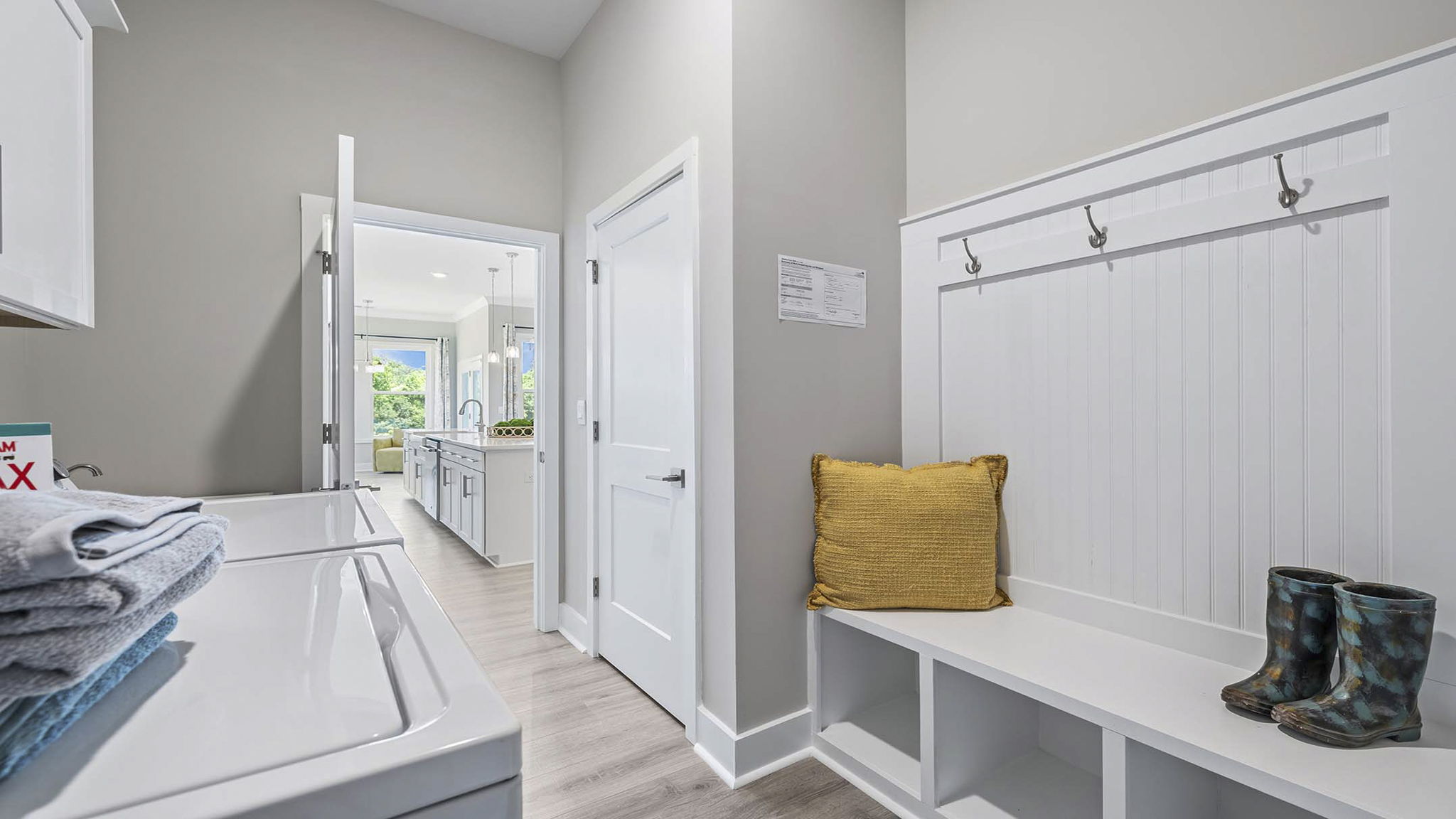 Laundry room with storage cabinets.
