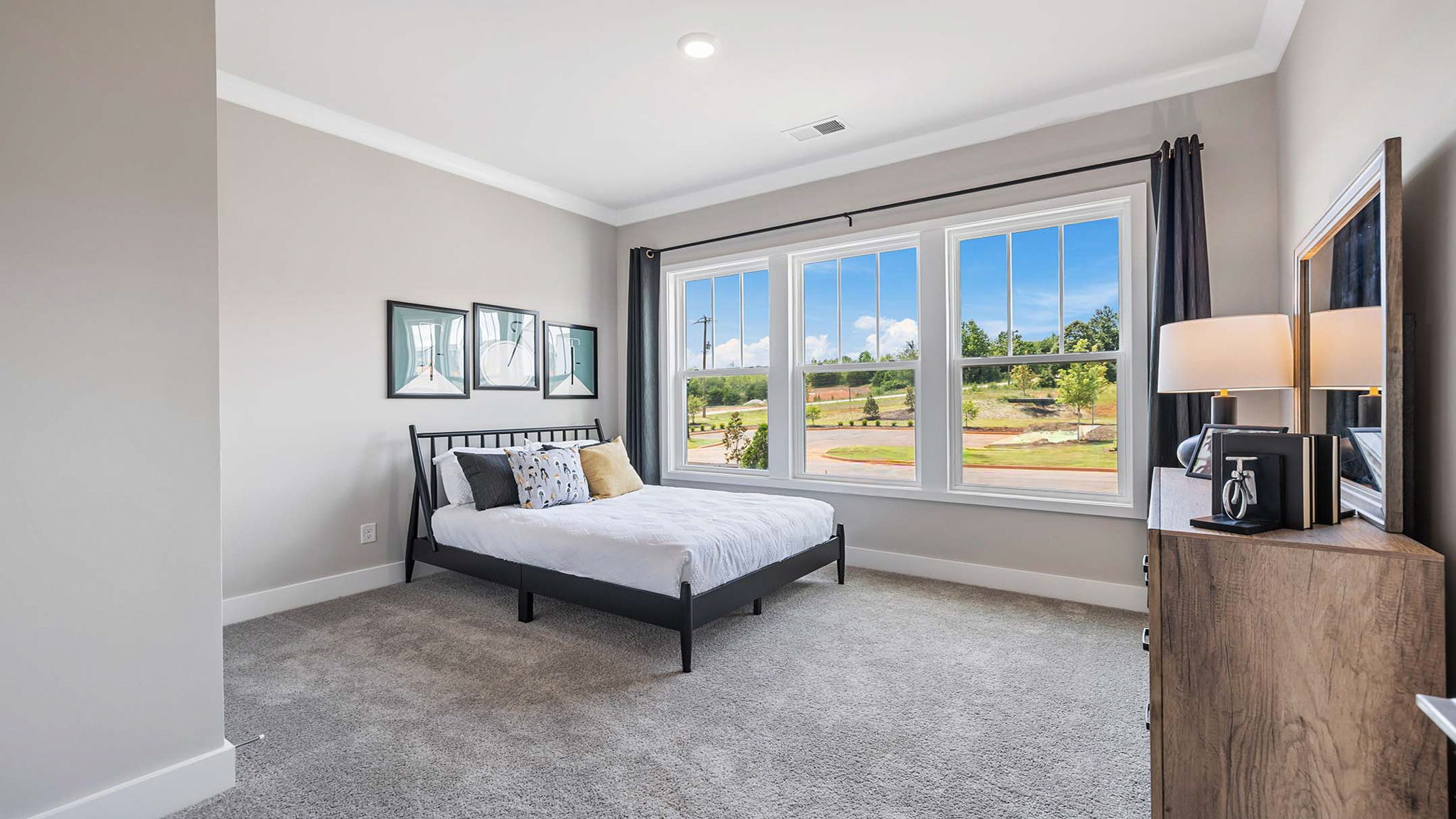 Bedroom with carpet and windows.