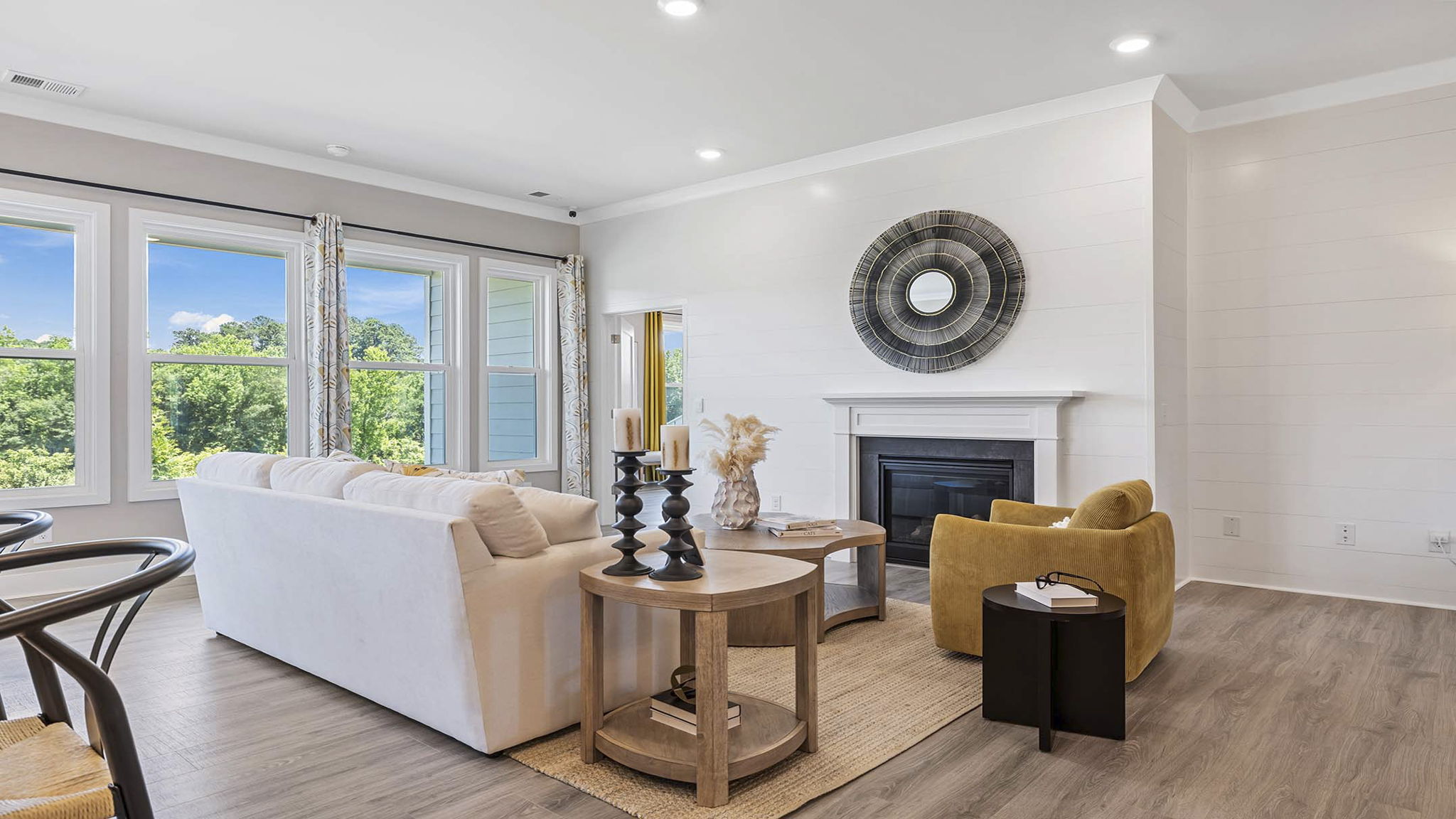 Living area with fireplace and windows.