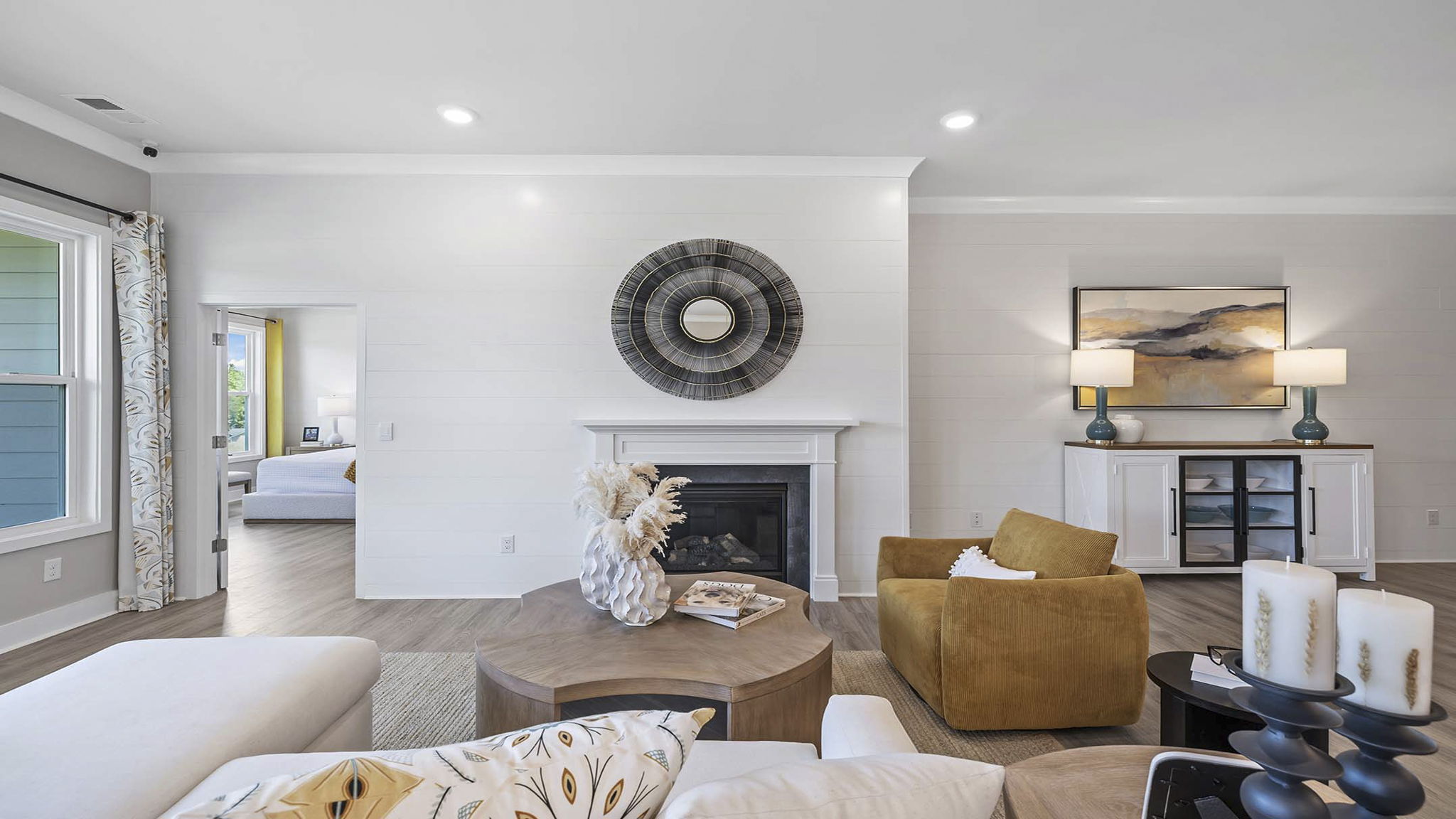 Living area with fireplace and windows.