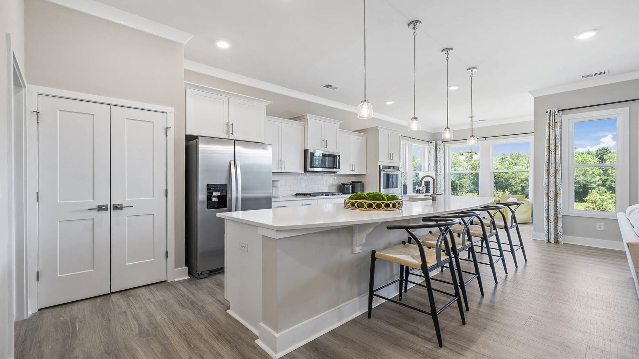 Kitchen with island and cabinets.
