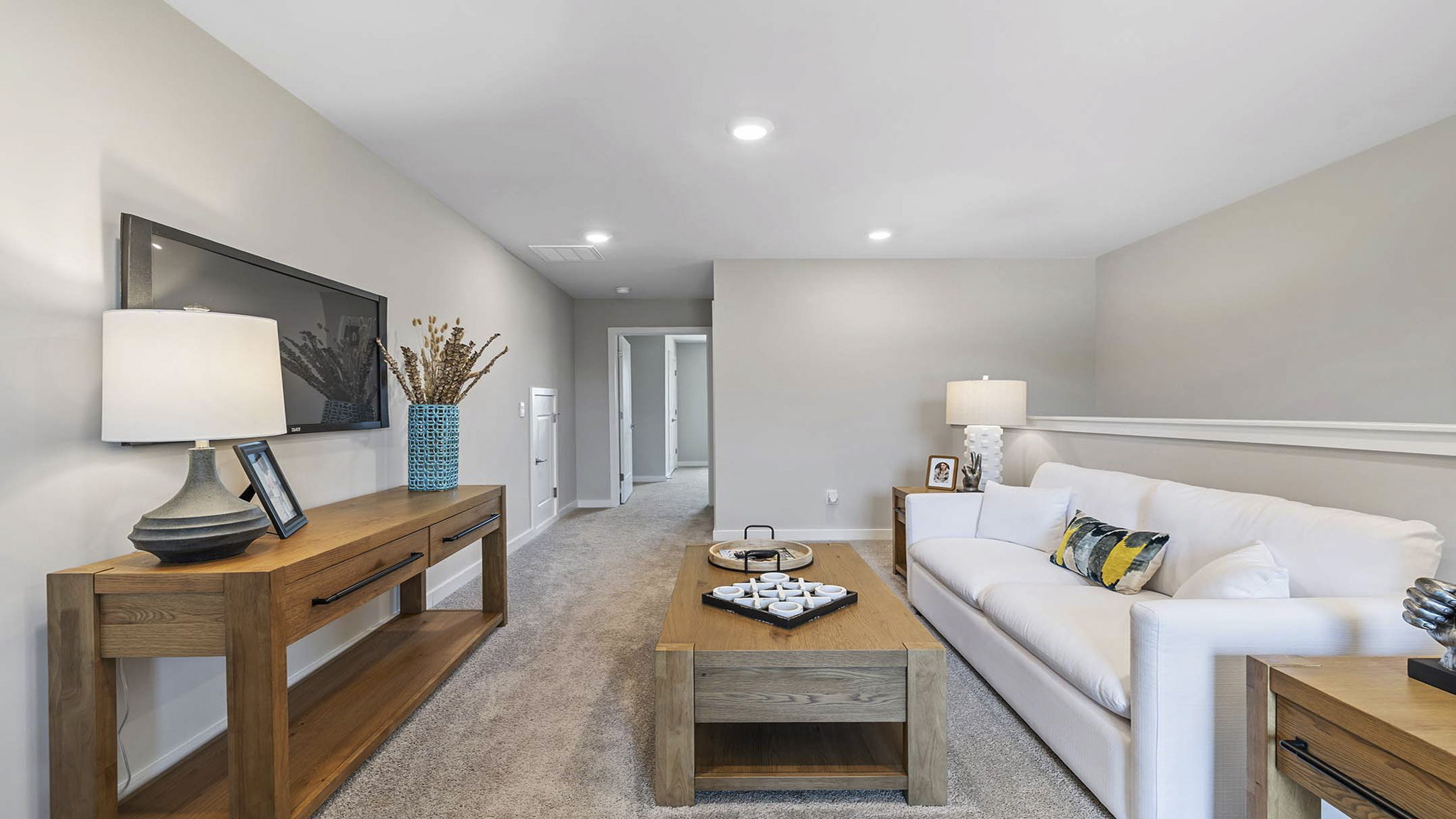 Loft with carpet and windows.